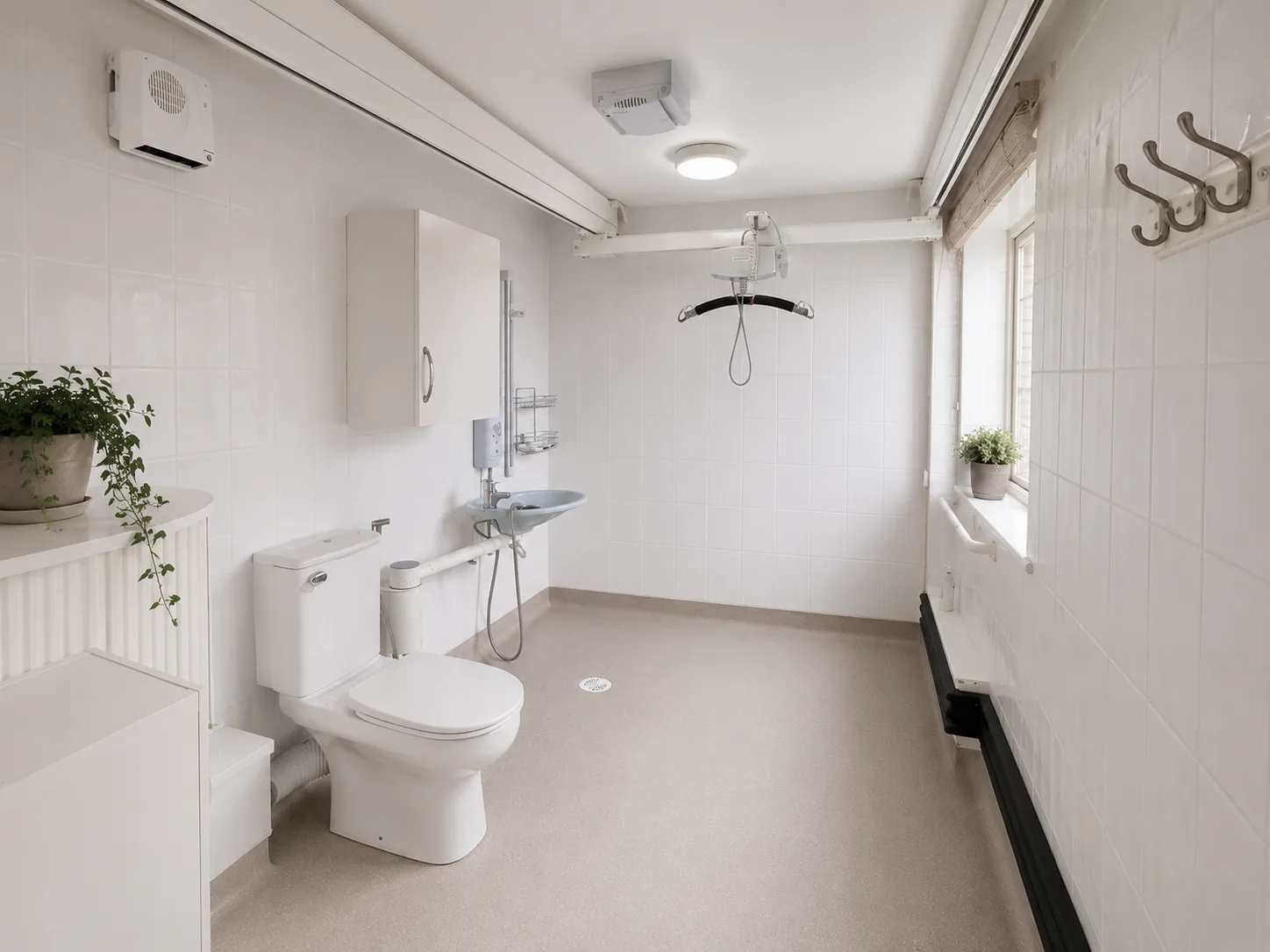 Accessible bathroom with a level-access shower and ceiling hoist